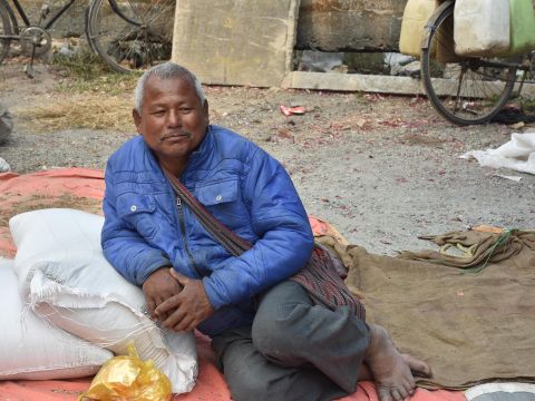 Boro man selling rice. A regular vendor