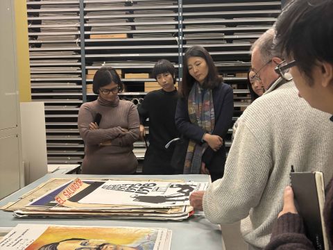 IIAS Fellows looking at archived posters from various social movements around the world. Photo Credit: Sarah Niazi