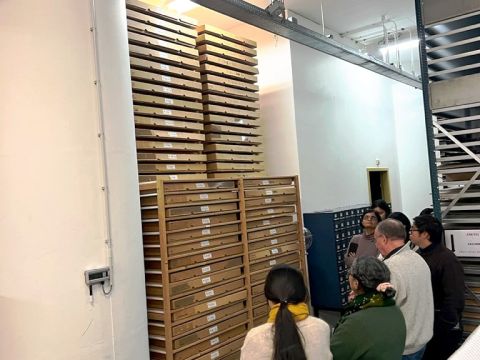 Eef and the IIAS fellows looking at the IISH's collection of textiles. Each box contains material picked up and donated from protests and social movements around the world Photo Credit: Cherelle Jaleesa Karsseboom