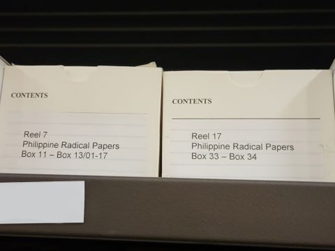 A piece of microfilm labelled "Philippine Radical Papers". These documents advocated for sociopolitical and socioeconomic change during the Marcos administration in the 1970s from political, religious, and student groups. Photo Credit: Enrico Joaquin Lapuz 