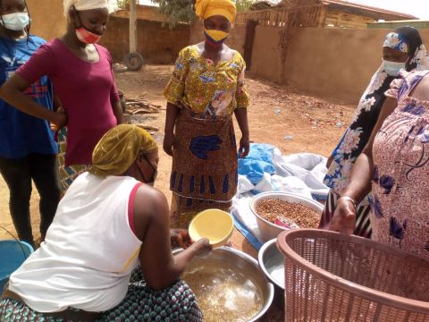 Burkinabe women washing and sorting African locust bean seeds for soumbala spice preparation; Credit: Jocelyne Vokouma (2024)